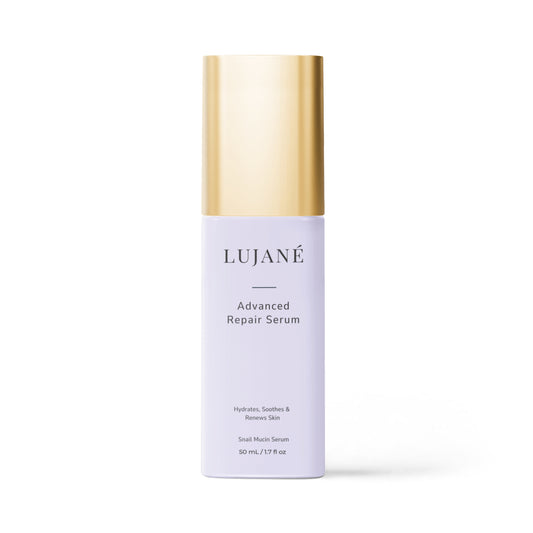 LUJANÉ Advanced Repair Serum in a premium lavender bottle with a gold cap; a potent snail mucin serum designed to hydrate, soothe, and renew skin for a healthy, revitalized complexion.