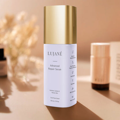 LUJANÉ Advanced Repair Serum in a premium lavender bottle with a gold cap; a potent snail mucin serum designed to hydrate, soothe, and renew skin for a healthy, revitalized complexion.