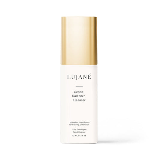 LUJANÉ Gentle Radiance Cleanser: A premium daily foaming oil facial cleanser in a sleek white bottle with a gold cap, designed for lightweight nourishment and glowing, silken skin.