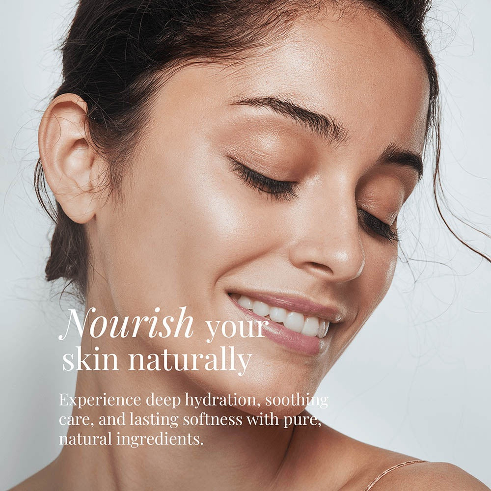 A woman with glowing, radiant skin demonstrating the natural results of LUJANÉ Renewal Balm, highlighting deep hydration, lasting softness, and soothing care from pure natural ingredients.