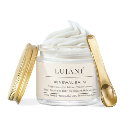 LUJANÉ Renewal Balm: A luxury whipped grass-fed tallow moisturizer with vitamin complex and gold applicator spoon for a radiant, balanced skin glow.