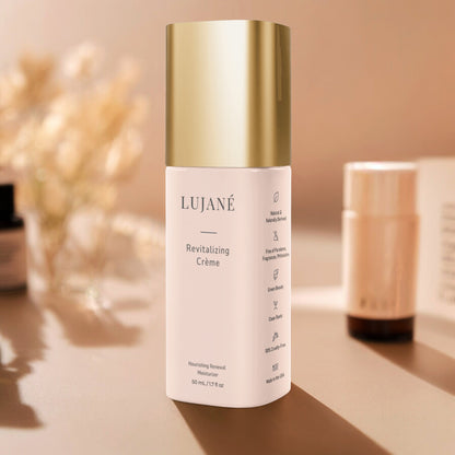 LUJANÉ Revitalizing Crème in a premium gold-capped bottle: a nourishing renewal moisturizer with squalane and hyaluronic acid designed to restore radiance and improve skin elasticity.